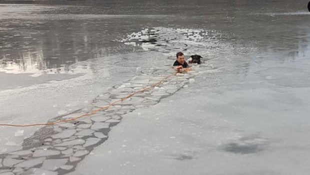 Dog rescue from frozen lake by a Police Officer